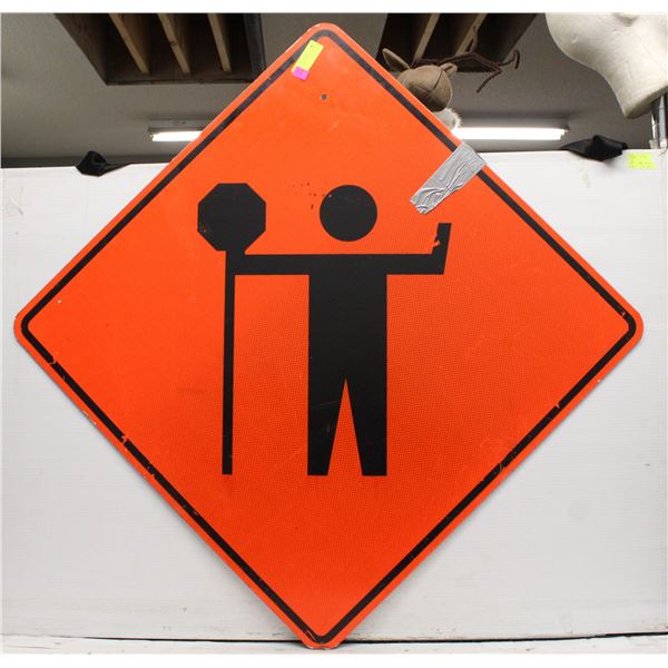 FLAG PERSON AHEAD ROAD SIGN