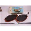 (2) Cast Iron Steak Platter with Lifters And Wooden Hot Plates