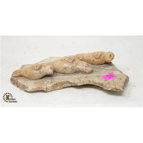 FAMILY OF SEALS STONE CARVING