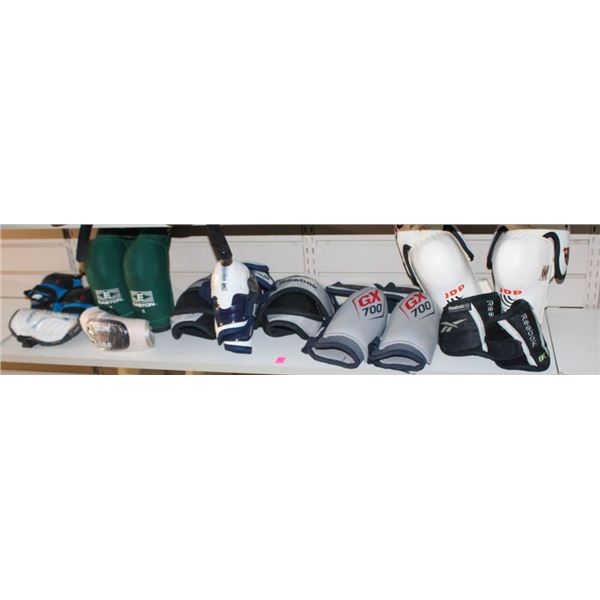 SHELF CONTENTS OF ASSORTED SPORTS PADS/ GUARDS