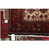 Image 2 : 100% hand made Iranian throw carpet "Baluchi" with red background, geometric pattern and highlights 