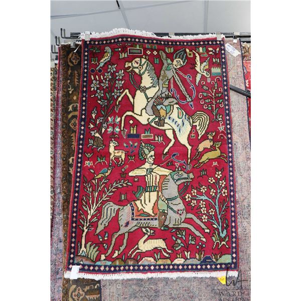 100% hand made Iranian wool carpet "Tabriz" with cranberry background and hunt scene with two mounte
