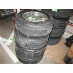 (4) P215/60R15 MUSTANG TIRES W/ ALUM WHEELS