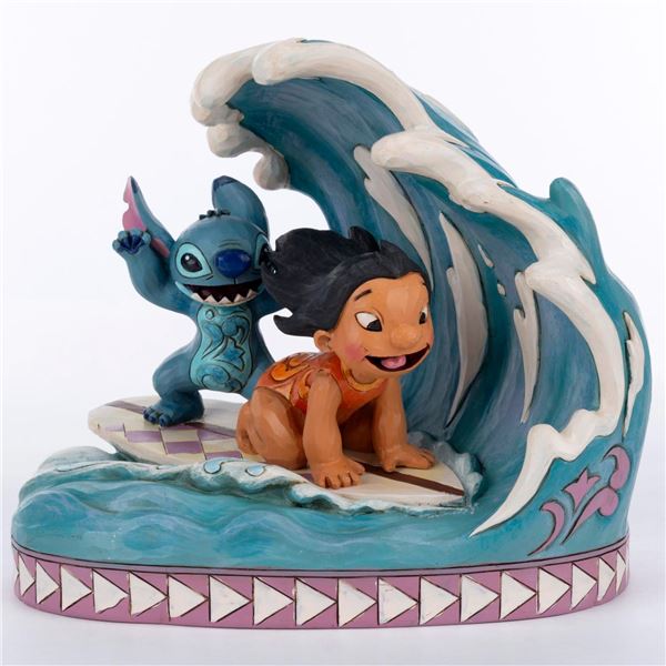 A Disney Traditions "Catch the Wave" Figurine.