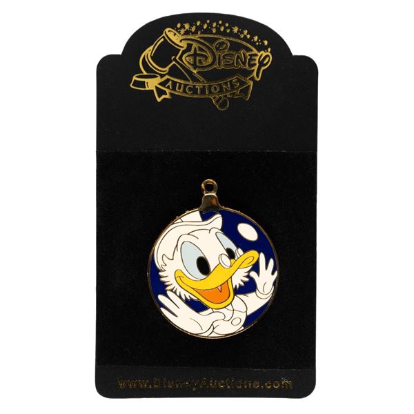 A Disney Auctions Uncle Scrooge Ornament Pin.