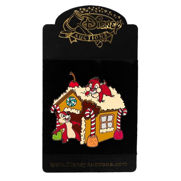 A Disney Auctions Chip and Dale Gingerbread House Pin.