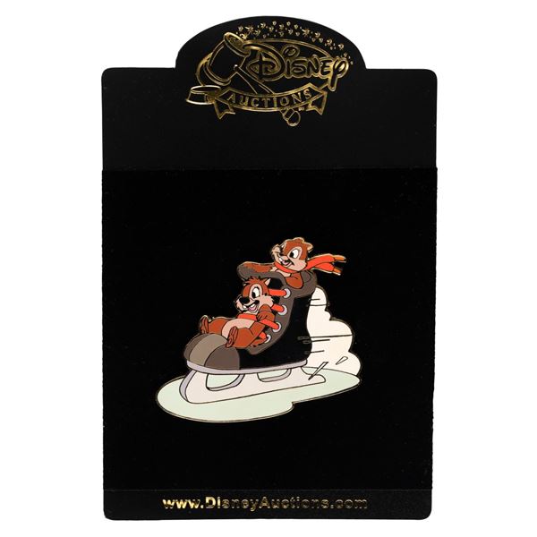 A Disney Auctions Chip and Dale Ice Skating Pin.