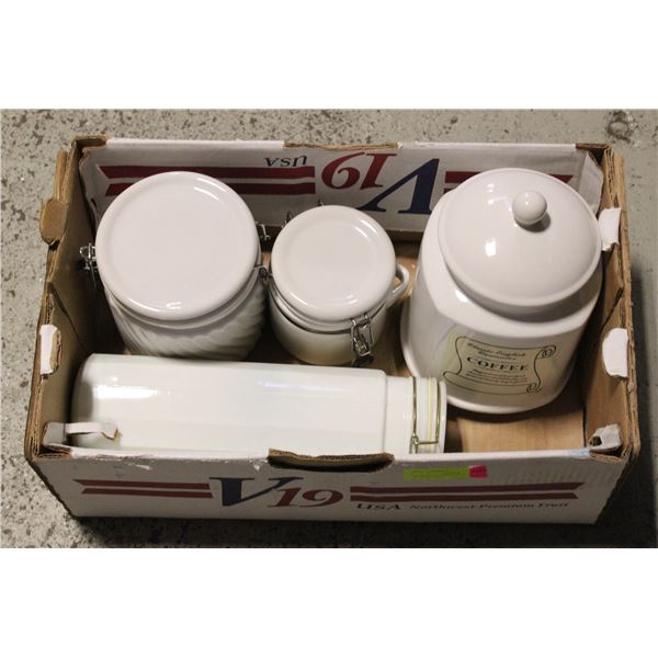 4 WHITE VINTAGE CANISTERS FROM 5" TO 13" TALL.