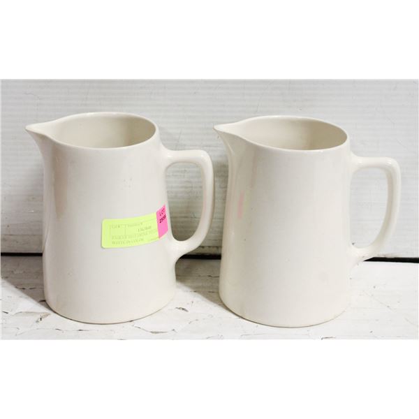 PAIR OF HOT DRINK PITCHERS WHITE IN COLOR