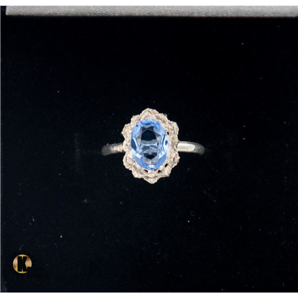 #1062-6.5 X 8 OVAL BLUE STONE SET IN 925