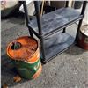 Image 2 : BLACK PLASTIC SHELF AND TWO OIL CANS