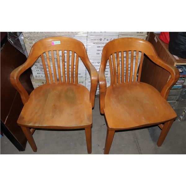 TWO VINTAGE SOLID WOOD LIBRARY CHAIRS.