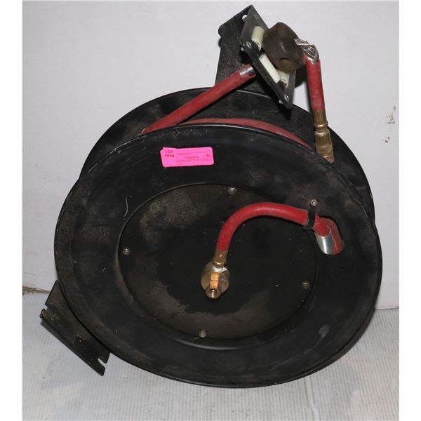 AIR COMPRESSOR HOSE ON REEL. HOSE IS IN