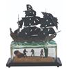 Image 1 : A Pirates of the Caribbean Black Pearl Figurine.