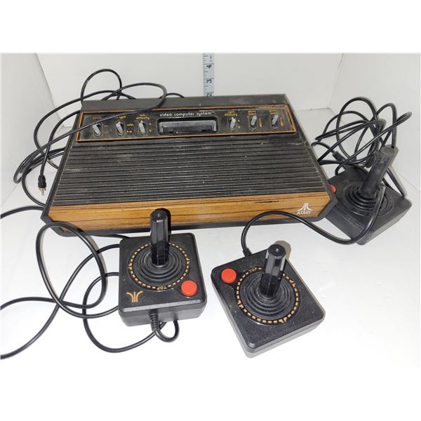 Vintage Atari Console with 3 Joystick Controllers