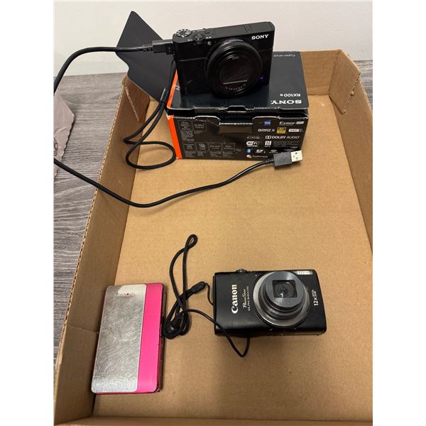 Sony camera RX 100, Canon power shot, and Sony camera