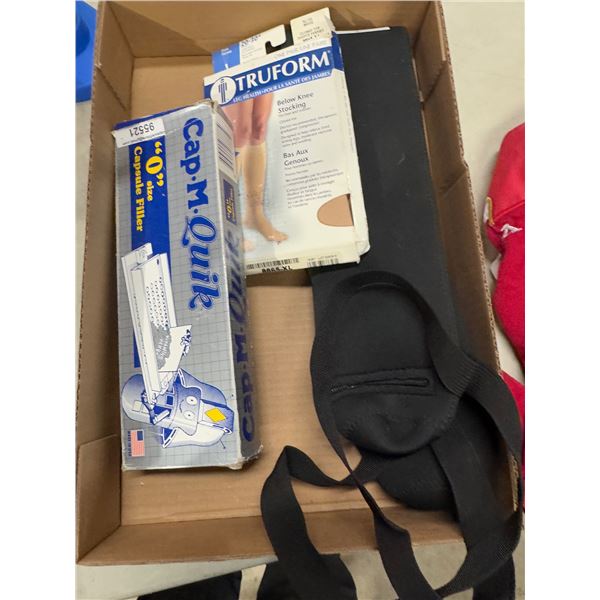 Below the knee stockings, vitamin box and other