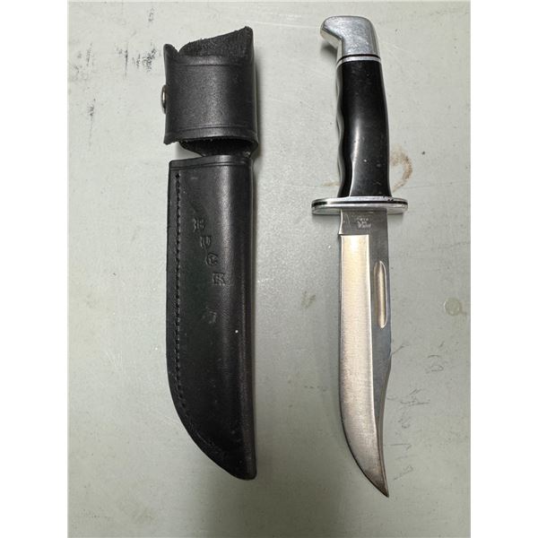 Buck, knife, and sheath