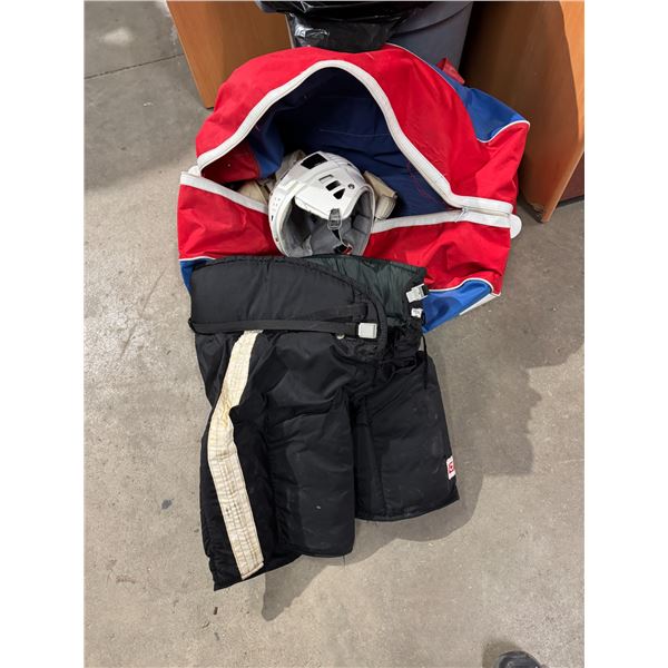 Hockey bag, pants, helmet, and elbow pants