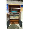 Image 2 : WOOD GLASS DOOR CABINET WITH ASSORTED WRAPPING PAPER CONTENTS 38.5" X 16" X 70"