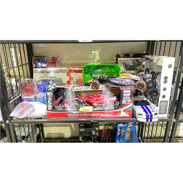 SHELF OF ASSORTED ITEMS INCLUDING; FORMULA ONE RC RACING CARS, DRONES, LUMISPHERES & MORE (UNKNOWN