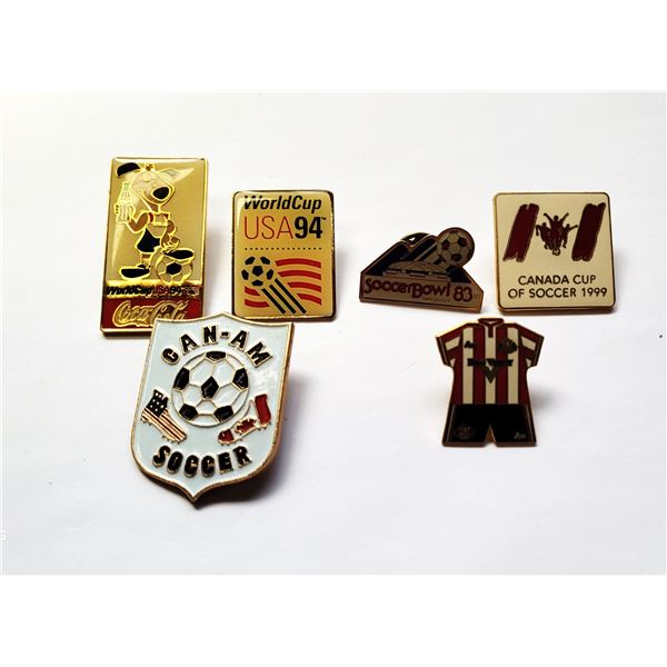 12) LOT OF 6 VINTAGE SOCCER LAPEL PINS.