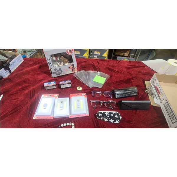 MISC LOT INCL: DOG PAW MONET TIN, DAISY PELLETS, THREE 240 LUMEN LIGHTS, MONEY SLEEVES, GLASSES