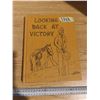 Image 1 : looking back at victory history book