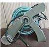 Image 1 : garden hose spinner with hose, nozzle and a split with extra hose