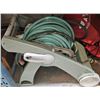 Image 2 : garden hose spinner with hose, nozzle and a split with extra hose