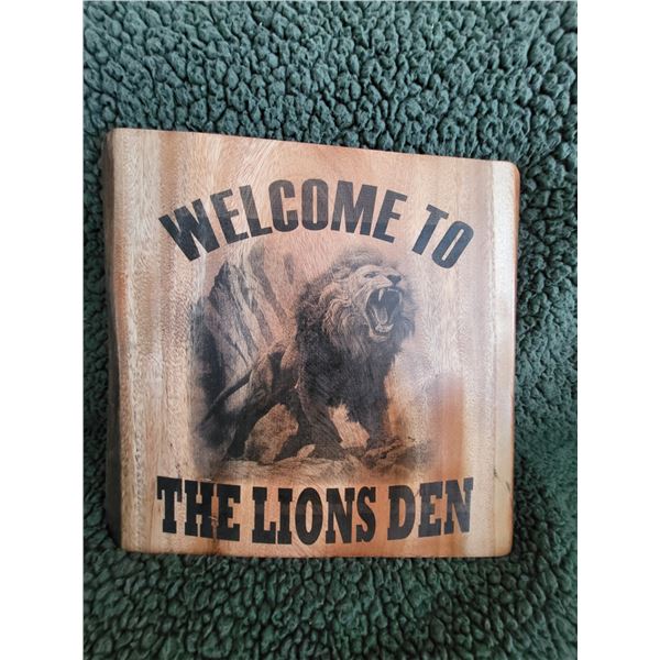 Laser burned wall sign - WELCOME TO THE LIONS DEN