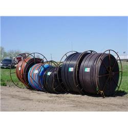 (5) SPOOLS OF 1in. - 2in. POLY PIPE (APPROX 7,000ft. PER SPOOL)