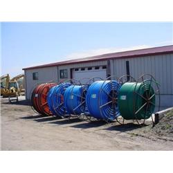 (5) SPOOLS OF 1in. - 2in. POLY PIPE (APPROX 7,000ft. PER SPOOL)