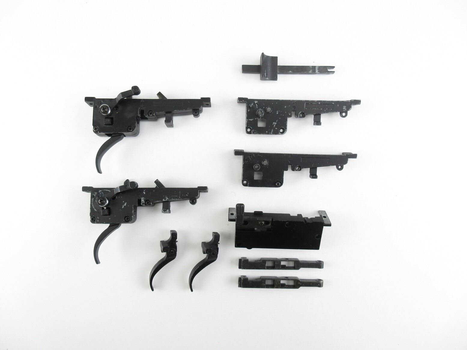 ASSORTED AIRSOFT GUN TRIGGER ASSEMBLIES AND TRIGGER PARTS LOT