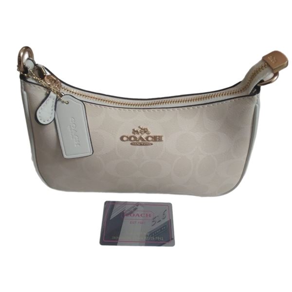 Brand new Coach Teri shoulder white bag. Vegan leather with fabric lining.