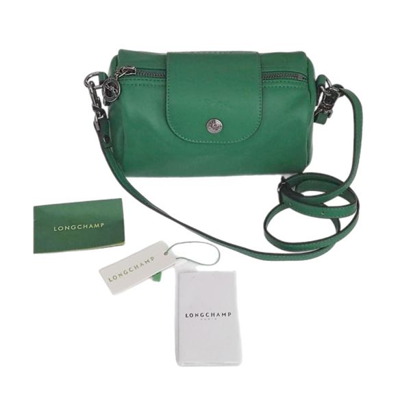 Brand new Longchamp's Pochette XS Le Pliage handbag in green.
