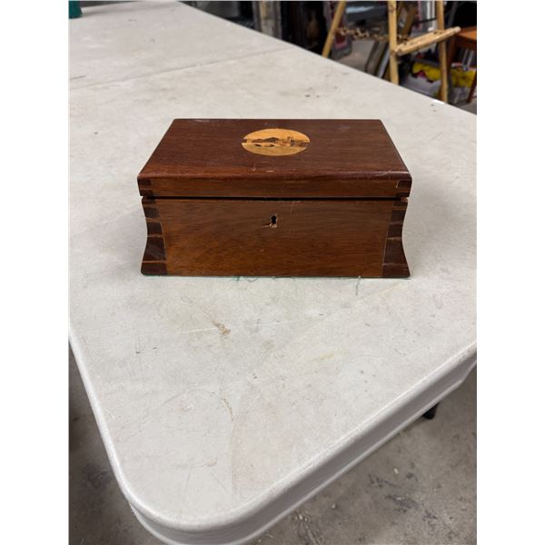 Curved wood box and nail clippers