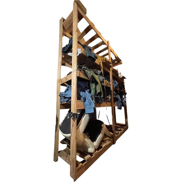 Shelving units full of assorted millitary clothing & misc