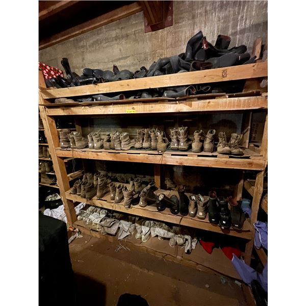Shelving units full of assorted millitary boots & misc items (shelving units included - approx 7ft l
