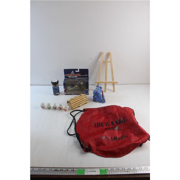 Family Guy Cups, Die Cast Motorcycle Replica, Rhino Coin Bank, Plate Stand and Soccer Bag