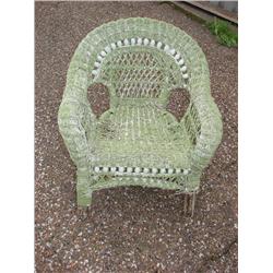 Green child's wicker chair
