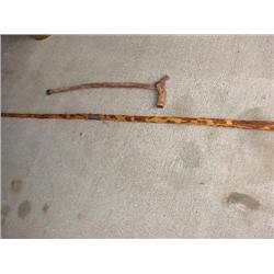 2 primitive walking sticks/cane