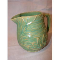 5" tall pottery creamer, marked 124