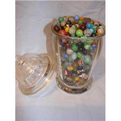 Glass jar filled with old marbles