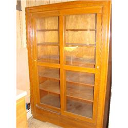 Glass front sliding door cabinet, 6 shelves.