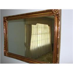 Ornate gold framed mirror