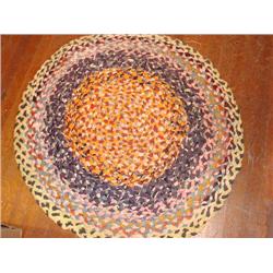 Vintage round hand braided rug.