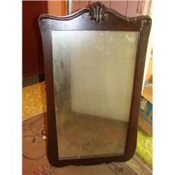 Ornate wood framed mirror