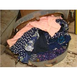 Old suitcase filled with vintage clothing