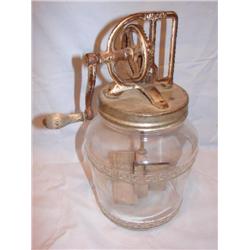 Old butter churn with raised Greek Key design